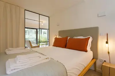an open kitchen with a table and a dining room at Zen Garden Studio B in Porto