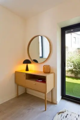 a mirror on top of a dresser in a room at Zen Garden Studio A in Porto