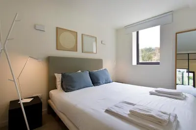 a living room with chairs and a table at Zen Garden Studio D in Porto