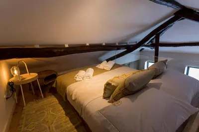 a bedroom with a bed with two towels on it at OPO Bonjardim 902 I in Porto