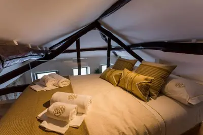 a bedroom with a bed with towels on it at OPO Bonjardim 902 I in Porto