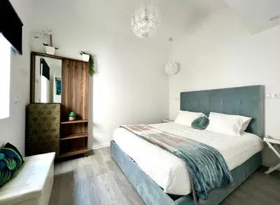 a bedroom with a large bed and a mirror at LUXURY PENTHOUSE - River Gallery Art - View&Center in Vila Nova de Gaia