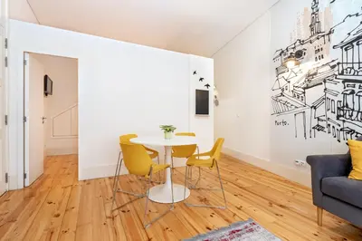 a dining room with a table and chairs at VIVA Trindade Downtown in Porto