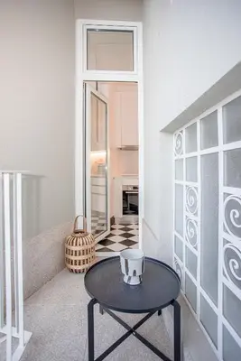 a living room with a table and a window at Liiiving in Porto - Art Design Apartment in Porto