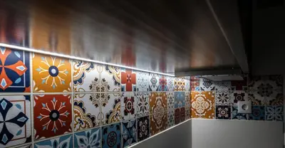 a kitchen with colorful tiles on the wall at Oporto Mi House in Porto