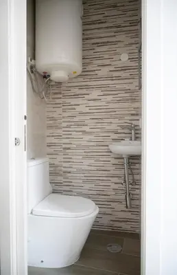 a bathroom with a toilet and a sink at Oporto Mi House in Porto