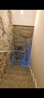 a stairway with a stone wall and a stone stair case at Oporto Mi House in Porto