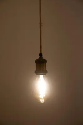 a light bulb hanging from a ceiling in a room at Oporto Mi House in Porto