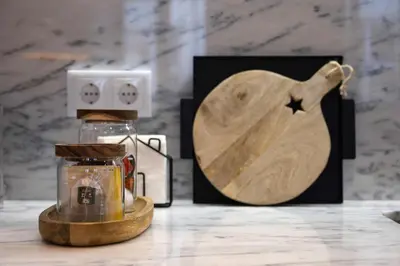 a jar with a wooden spoon next to a box and a lantern at Away to Discover Apartment - hapiness has a place in Porto