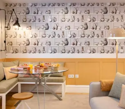 a living room with a table in front of a wall at Away to Discover Apartment - hapiness has a place in Porto