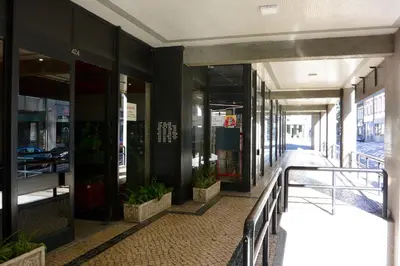 a hallway of a building with glass doors and plants at Porto Vista II by Flat in Porto in Porto