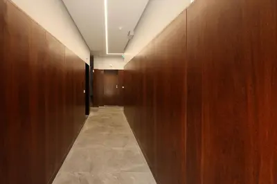a corridor with wooden walls and a hallway with a corridorngthngthngthngthngth at FLH Gaia Homey Winery Flat in Vila Nova de Gaia