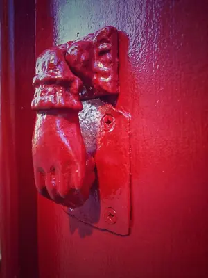 a red door with a red door knob on it at Apartments2Stay I Porto - Flores in Porto