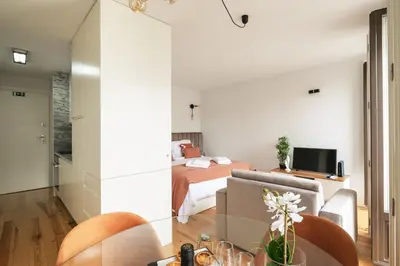 a small apartment with a bedroom and a bed at Bright Studio near Douro River - with Balcony in Porto