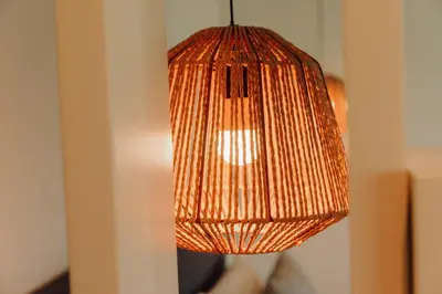 a brown lamp hanging from a wall at JARS Apartments - Casa do Bessa in Porto