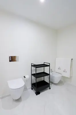 a white bathroom with a toilet and a sink at HM - ISSY Oporto Apartment in Porto
