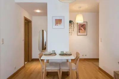 a bedroom with two beds and two lamps at Boavista Boho Apartment w/ Garage in Porto
