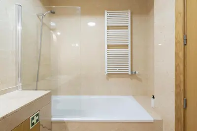 a kitchen with white cabinets and a sink at Boavista Boho Apartment w/ Garage in Porto
