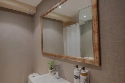 a bathroom with a sink and a mirror at Sunny and Spacious House, 4BD 3Bath Downtown Porto in Porto