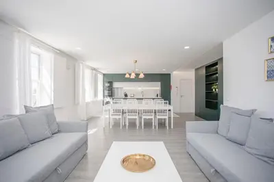 a living room with two couches and a dining room at Liiiving in Porto - Ribeira Riverside Apartment in Porto