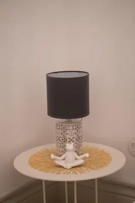 a lamp on top of a table with a lamp at Porto Contemporary Apartment in city center in Porto