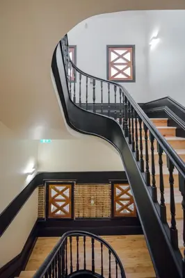 a spiral staircase in a house with wooden floors at Ribeira apartment 6M- vista fabulosa in Porto