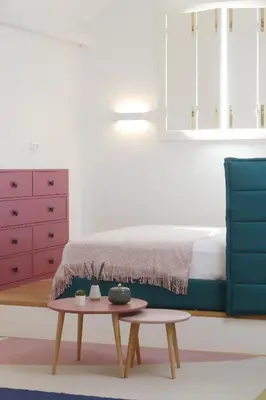 a bedroom with a bed and a coffee table at Ribeira apartment 6M- vista fabulosa in Porto