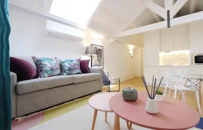 a living room with a couch and a table at Ribeira apartment 6M- vista fabulosa in Porto