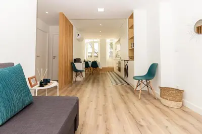a living room with a couch and a table at Oporto Modern Apartments - Campanha Train Station in Porto