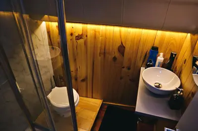 a bathroom with a toilet and a sink at SLEEPBOAT LuxLife Yatch in Porto