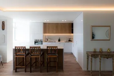 a kitchen with a table and chairs in a room at Alegria Porto by We Do Living in Porto