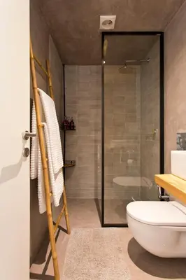 a bathroom with a glass shower and a toilet at Boutique Rentals- Hidden Garden Porto's downtown in Porto