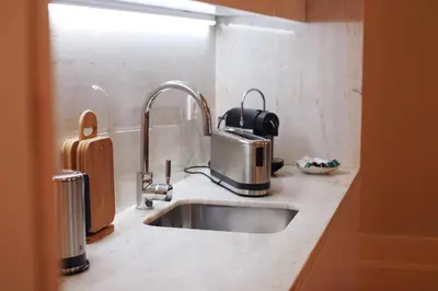 a kitchen counter with a sink and aounter at CASA SANTO ILDEFONSO in Porto