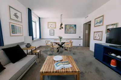 a living room with a couch and a table at The Editory Artist Baixa Porto Hotel in Porto
