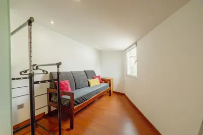 a living room with a couch and a window at OPORTO GUEST Oliveira House in Porto