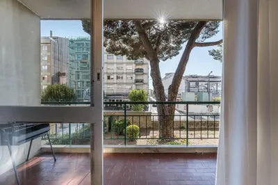 a view of a tree from a balcony at GuestReady - Shades of Blue with Balcony in Porto