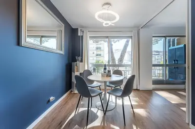 a dining room with blue walls and a table and chairs at GuestReady - Shades of Blue with Balcony in Porto