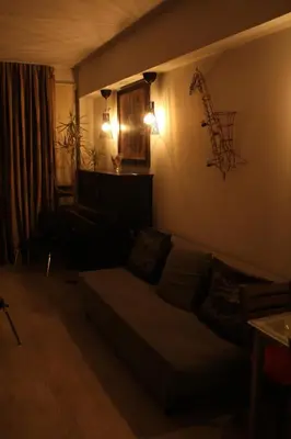 a living room with a couch and lights on the wall at Apartment Art Jazz Music in Porto