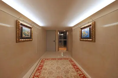 a hallway with two mirrors and a rug at FLH Porto Clérigos Luxury Apartments in Porto