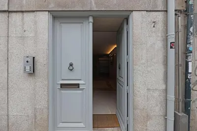 an open door to a hallway in a building at FLH Porto Clérigos Luxury Apartments in Porto