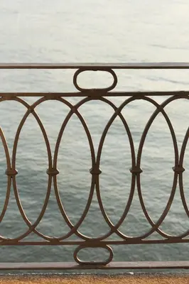 a metal railing next to a body of water at 1872 River House by Olivia in Porto