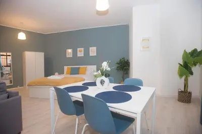 a room with a table and chairs and a bed at Bonsai Apartment IIII in Porto