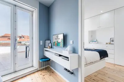 a bedroom with a bed and a large window at GuestReady - The Other Side in Porto