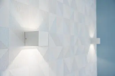 a white wall with a light on it at GuestReady - The Other Side in Porto