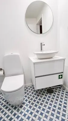 a bathroom with a sink and a toilet and a mirror at Jardim do Morro Haus in Vila Nova de Gaia