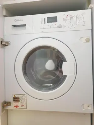 a white washing machine sitting in a room at Oporto Golden Flat in Porto