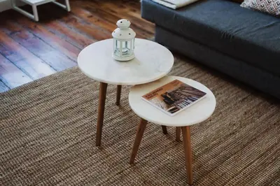 a white coffee table with a book and a lamp on it at Skyline Cosy House, Downtown Porto near metro in Porto