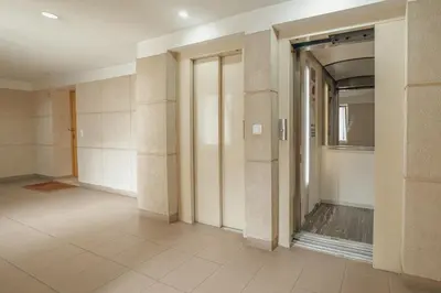an empty hallway with a door and a tile floor at Downtown Trindade Apartment With Terrace by Vacationy in Porto