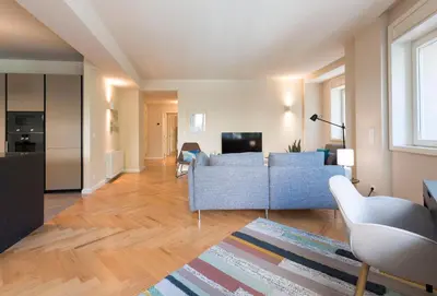 a living room with two couches and a tv at Luxury City Center Emporium in Porto