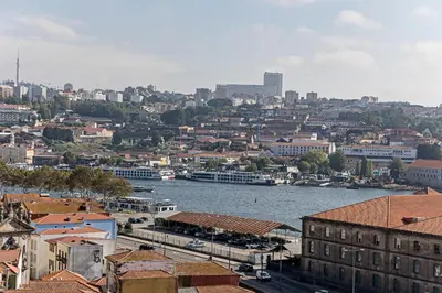a view of a city with a river and buildings at Wonderful Flat Near River w/ AC by LovelyStay in Porto